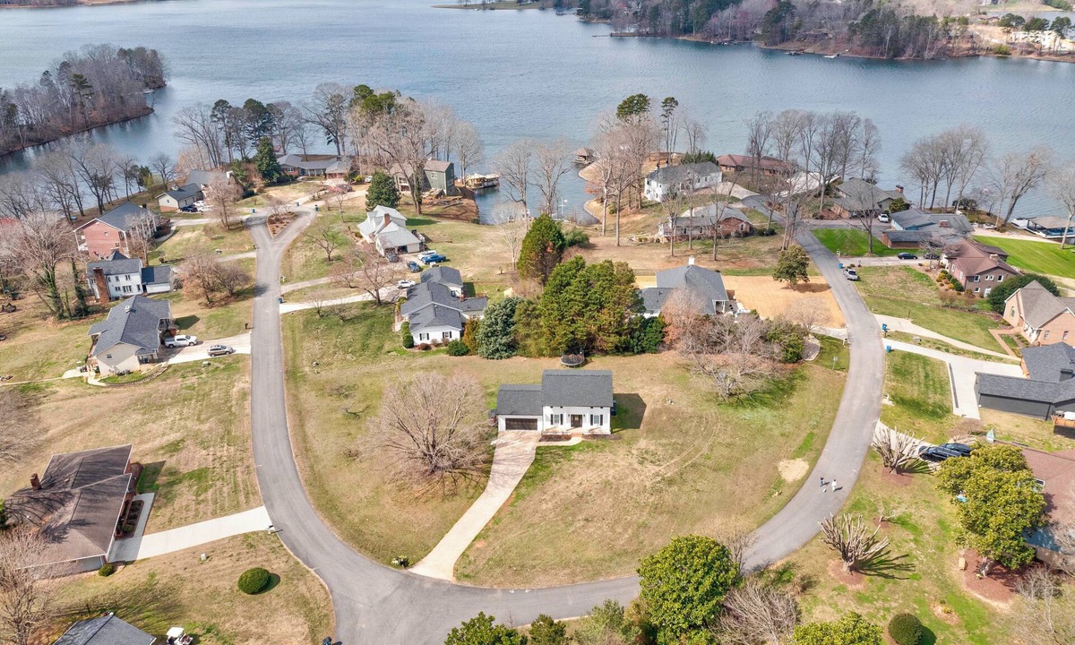 Crouse House | Charming house in a golf course community with lake views and a big yard.