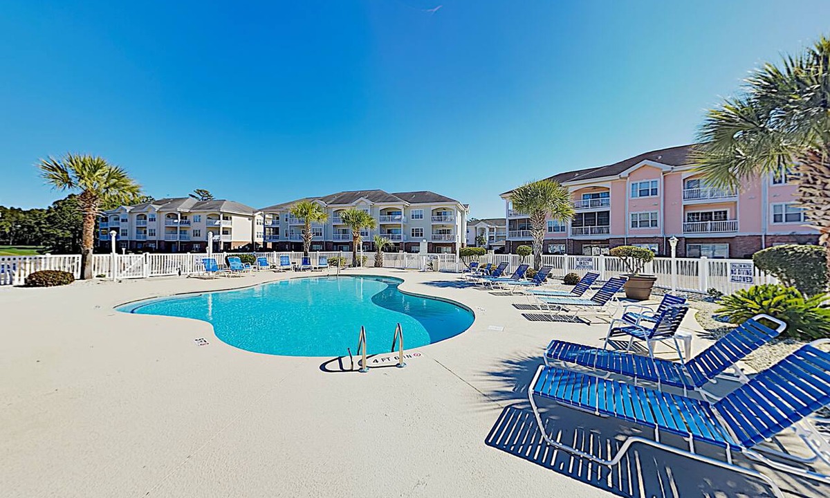 Central Myrtle Beach Condo | Dual-suite Magnolia Pointe condo with golf, pools, and screened patio