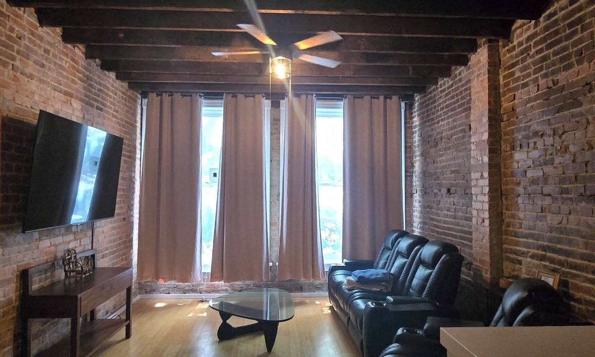 Monroe Ward Apartment | Large 1-bedroom apt with tall ceilings, brick walls, large tv, modern bathroom
