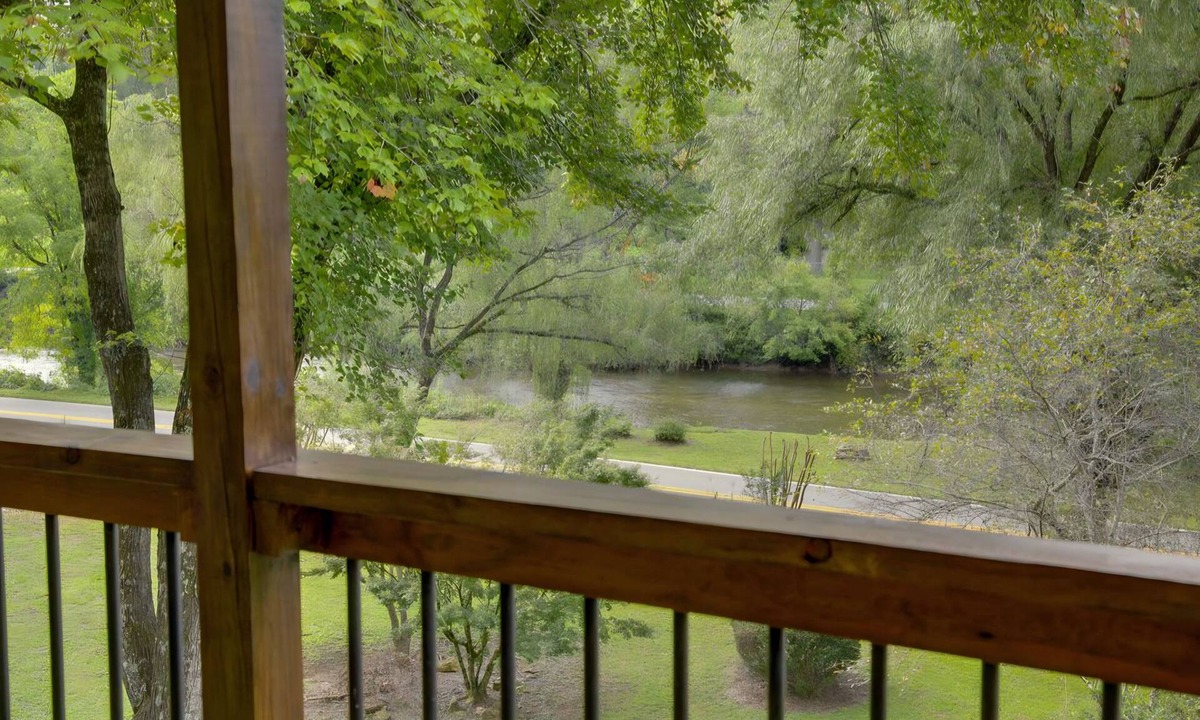 Sylva Cottage | Pet Friendly Riverfront Home near WCU! Trout fishing near Cullowhee & Smoky Mtns