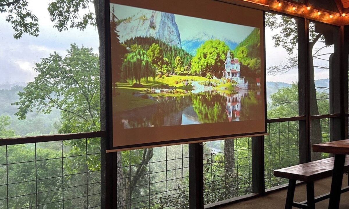 Raccoon Ridge Cabin | Riverbend Treehouse-Mountain/River Views, Hot Tub, Arcade, Outdoor Movie Screen