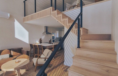 Riverport Cabin | A sanctuary of architectural restraint and unmediated coastal observation.