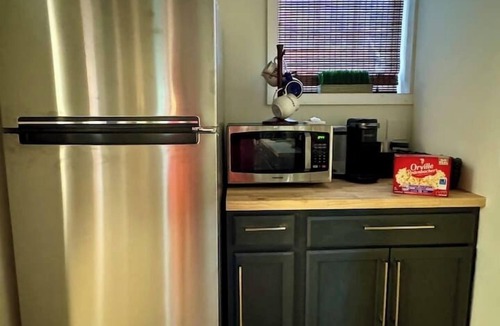 Belmont Historic District Apartment | Belmont Millside Studio—Warm Industrial & Chic
