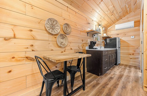 Hartwell RV Rental | Cabin #8: Studio style layout with kitchenette and a large gravel parking pad beside the cabin for easy boat or trailer storage.
