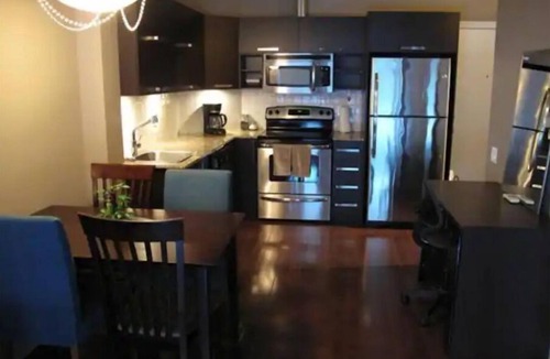 International District Condo | Chic Luxury Downtown Condo with Pool & Garage !