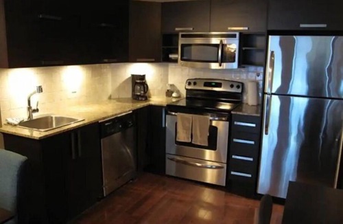 International District Condo | Chic Luxury Downtown Condo with Pool & Garage !