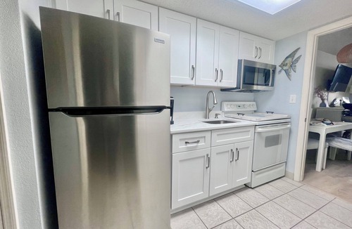 Crescent Beach Resort | Coastal Beachfront Paradise! Resort Style Amenities with a BRAND NEW KITCHEN!