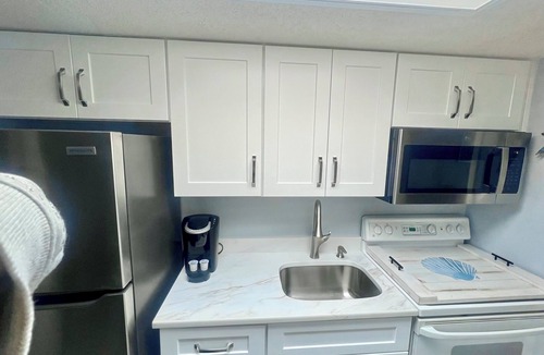 Crescent Beach Resort | Coastal Beachfront Paradise! Resort Style Amenities with a BRAND NEW KITCHEN!