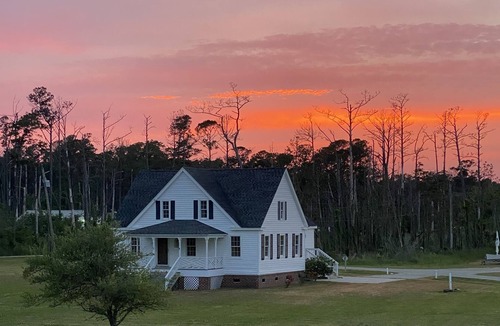 Stacy Cottage | Core Sound Waterfront Cottage with boat ramp and dock on the property.