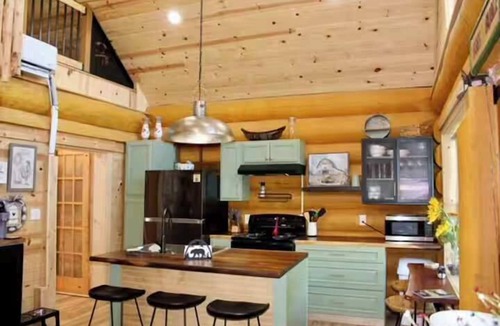 Edray Cabin | Custom Log Home directly along the Greenbrier River sits the River Ridge Retreat