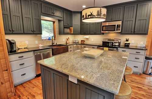 Warrensville Ski Chalet | Discover Moonshine River-a river front 4-bedroom cabin perfect for 8 guests!