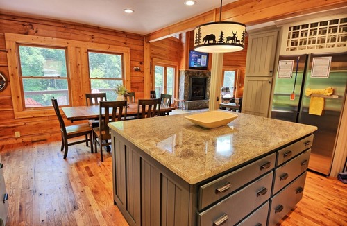 Warrensville Ski Chalet | Discover Moonshine River-a river front 4-bedroom cabin perfect for 8 guests!