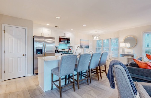 Sea Trail Condo | Ev's Escape,201A: Modern condo with sunroom - dog and snowbird-friendly