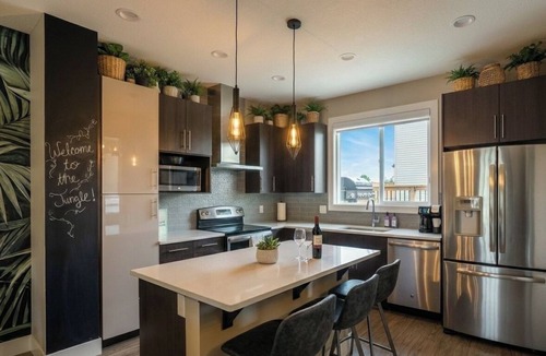 Southeast Edmonton House | Family-Friendly Jungle Themed Home with Hot Tub, AC, and Tree Bunks.