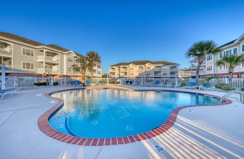 Central Myrtle Beach Condo | Golf course view condo with private balcony, W/D, pool & close to beach