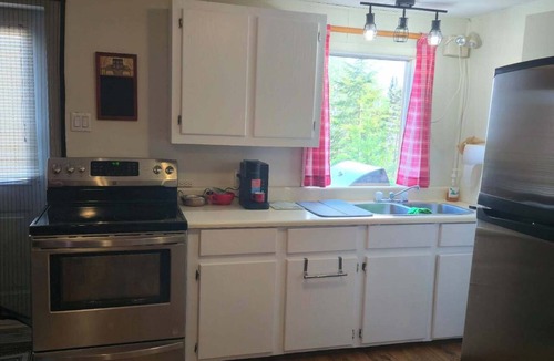 La Malbaie Cabin | Horse shelter. Located on a ranch with a view of the horses. Pets allowed.