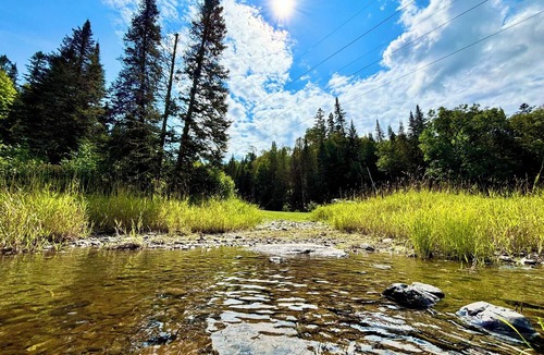 Fort Kent Mills RV Rental | Junction 19 & Co. Riverfront Campsite #1 - Cozy & Tranquil - In Town & On Trails