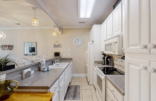 Carolina Yacht Landing Condo | Lakefront condo with private patio, pool, close to beach