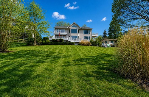 Livingston House | Lakefront retreat with views, hot tub, kid's play area, dock & fiber internet