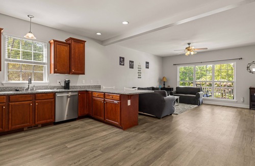 Louisa House | Lakeview escape near beach with fenced dog run, porch & dock with one boat slip