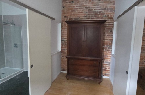 Monroe Ward Apartment | Large 1-bedroom apt with tall ceilings, brick walls, large tv, modern bathroom