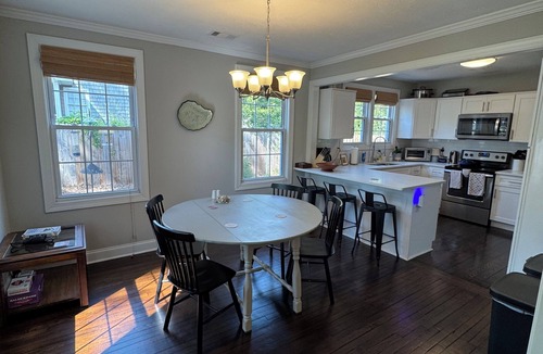 Pendleton King House | Masters rental with spacious back porch, fenced in yard, and park frontage.