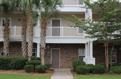 North Myrtle Beach Condo | Modern condo across from pool, near beach and on 9th hole of Norman golf course!