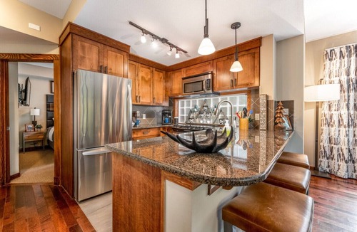 Canmore Condo | Mountain Memories - Luxury Condo - Outdoor Pool, Hot Tub & Sauna