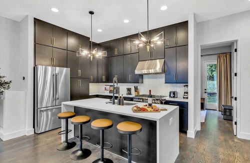 Katie Hill Neighborhood House | Nashville getaway: 2 rooftop hot tubs, game rooms & makeup bars, sleeps 24
