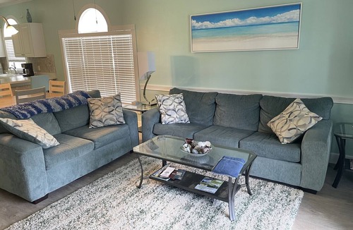 Central Myrtle Beach Condo | Pet Friendly 2 BR - Golf Course View! 1st Floor with screen door off back porch