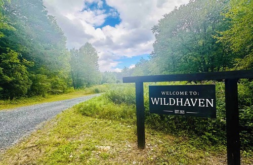Newland Cottage | Petite Airstream Cottage w Private Hot Tub & Wellness Courtyard Access 30 acres