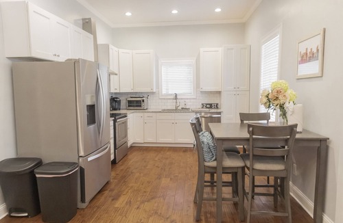 McFerrin Park House | Prime Location, Sleeps 10, 7 Beds, Cozy Front Porch and patio with Hot Tub