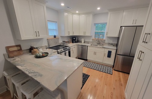 Maryville House | Pristine creekside home in peaceful Maryville with sprawling yard and deck.