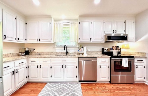 North Chesterfield Cottage | Relax in this spacious Richmond retreat featuring a private hot tub, comfortable living spaces, and easy access to downtown, shopping, dining, sporting events, and the area's top attractions.
