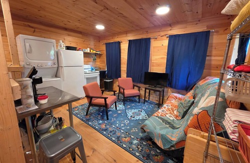 Charlotte Cabin | Round Lake Cabin. Escape to lake life close to amenities and attractions.