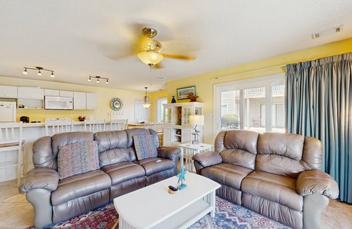 Sea Trail Condo | SB64: Lakefront condo with patio, AC, & water views plus pool & tennis