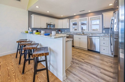 Wind Over Waves House | SemiSoundfront Dog Friendly w/Pool, Elevator, Hot Tub, Tiki Bar, Cmty Boat Ramp