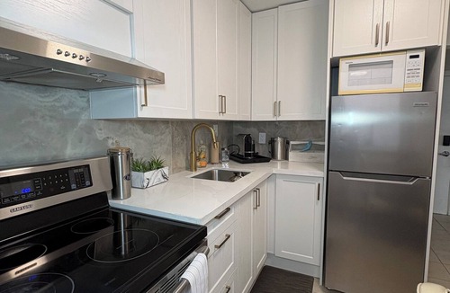 Mimico Apartment | Stylish 2BR Retreat: Large Private Patio & BBQ