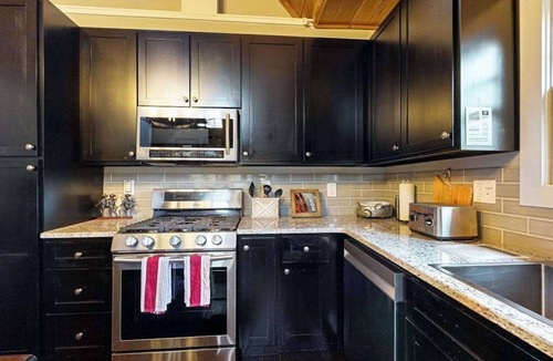 Cullowhee House | Take in the natural beauty from this elegant riverfront home