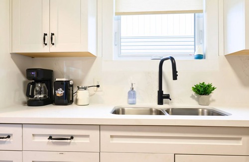 Timmins Apartment | The Redbrick Residence - 3 bedroom main floor home with AC + covered patio