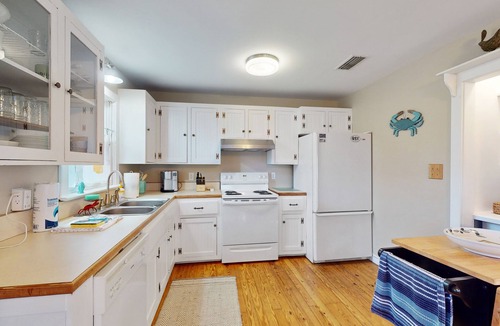 Colington Harbour House | Waterfront 3BR with pool, hot tub, tennis, & patio