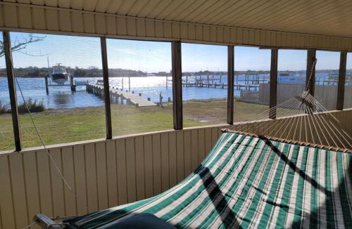 Cedar Point House | Waterfront home with Private Dock Hot tub and swimming as well as a large fenced backyard
