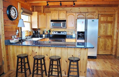 Jefferson Cabin | Waters Edge Riverfront Cabin | Hot Tub, Firepit & New River Views for the Whole Family
