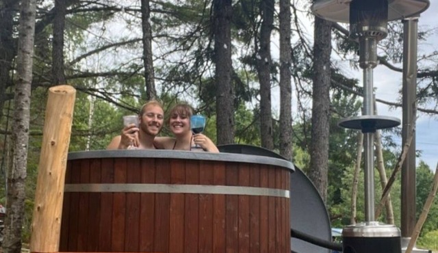 26ft Geodesic Dome nestled in the trees with hot tub and Grand Lake steps away.