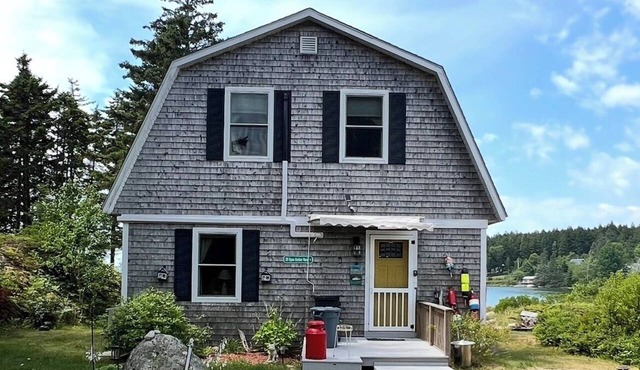 3-bedroom house with 2 full baths in Burnt Cove Harbor in Stonington Maine .