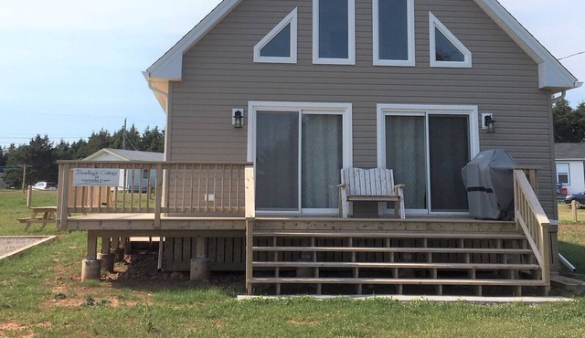 Beach House across from Savage Harbour Beach with Spectacular Ocean View!
