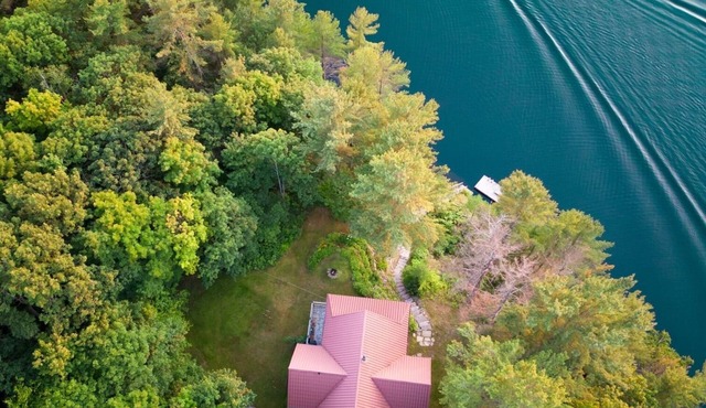 Beautiful 5 bedrooms waterfront cottage sits on a private 4 acres wooded lot!
