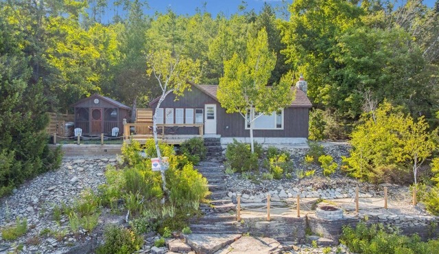 Cedar & Stone is a TICO licenced serene waterfront escape in exclusive Dyers Bay. Nestled between Georgian Bay and the Niagara Escarpment, this stylishly renovated cottage offers peaceful mornings, cozy evenings, and nature right at your doorstep.