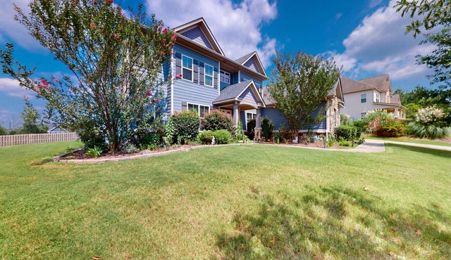 Champions Retreat | Dog-friendly home with fireplace, grill, and sunny patio