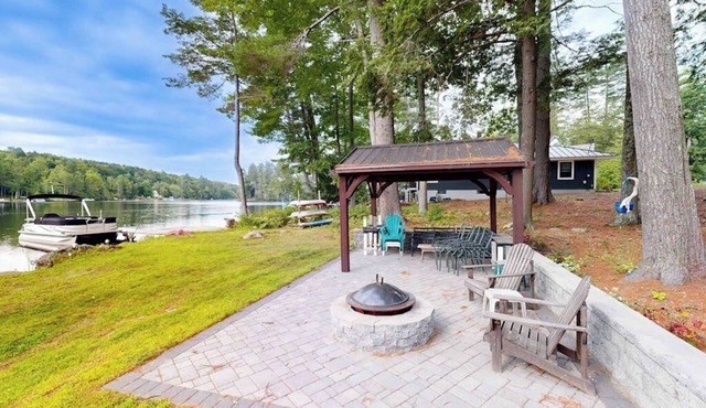 Charming apartment with waterfront access, modern comforts, and lakeside firepit
